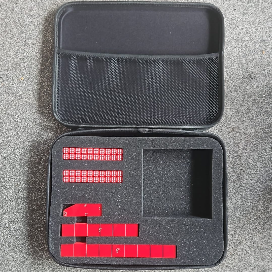 Black carrying case with red dice on a gray surface