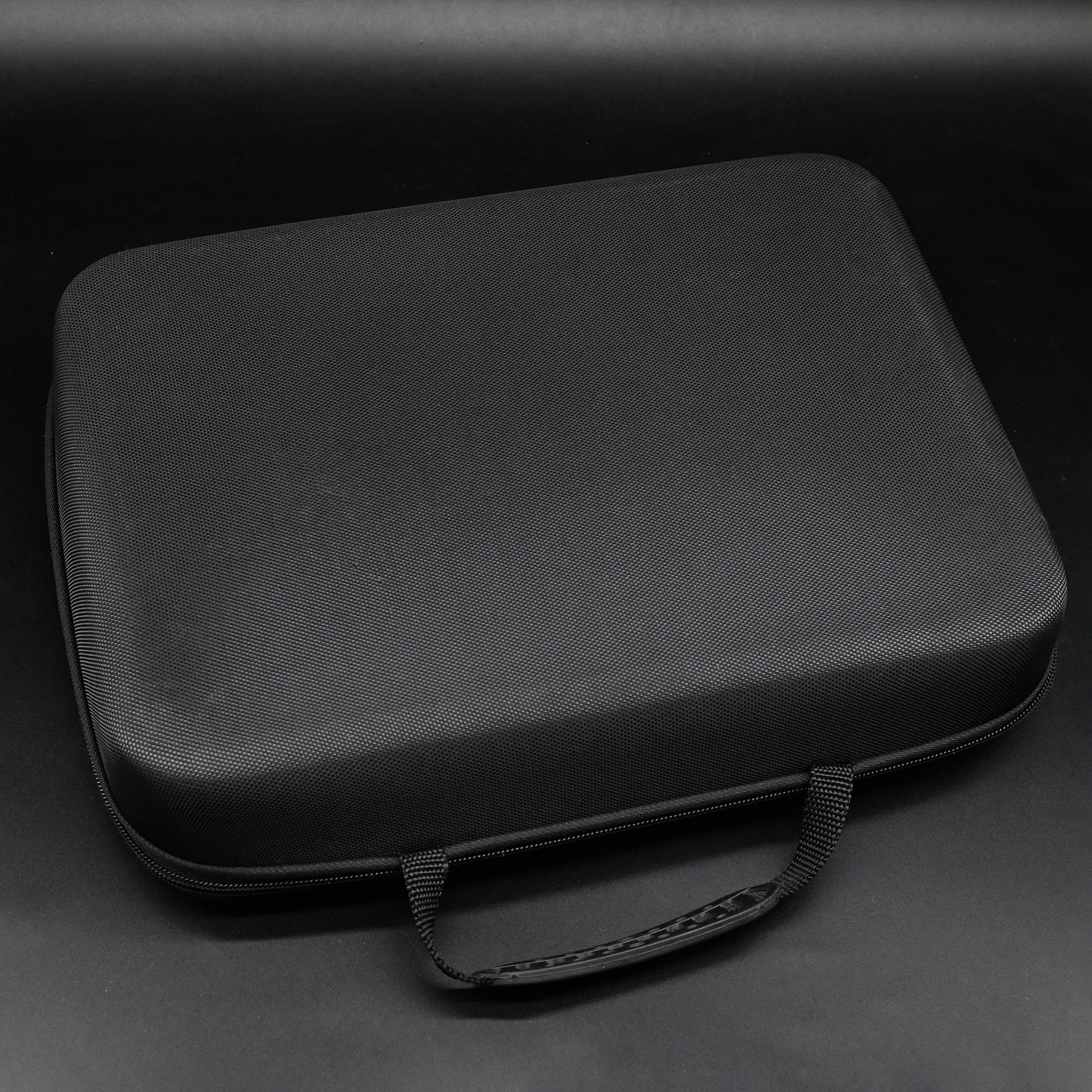 Black carrying case on a dark gray background