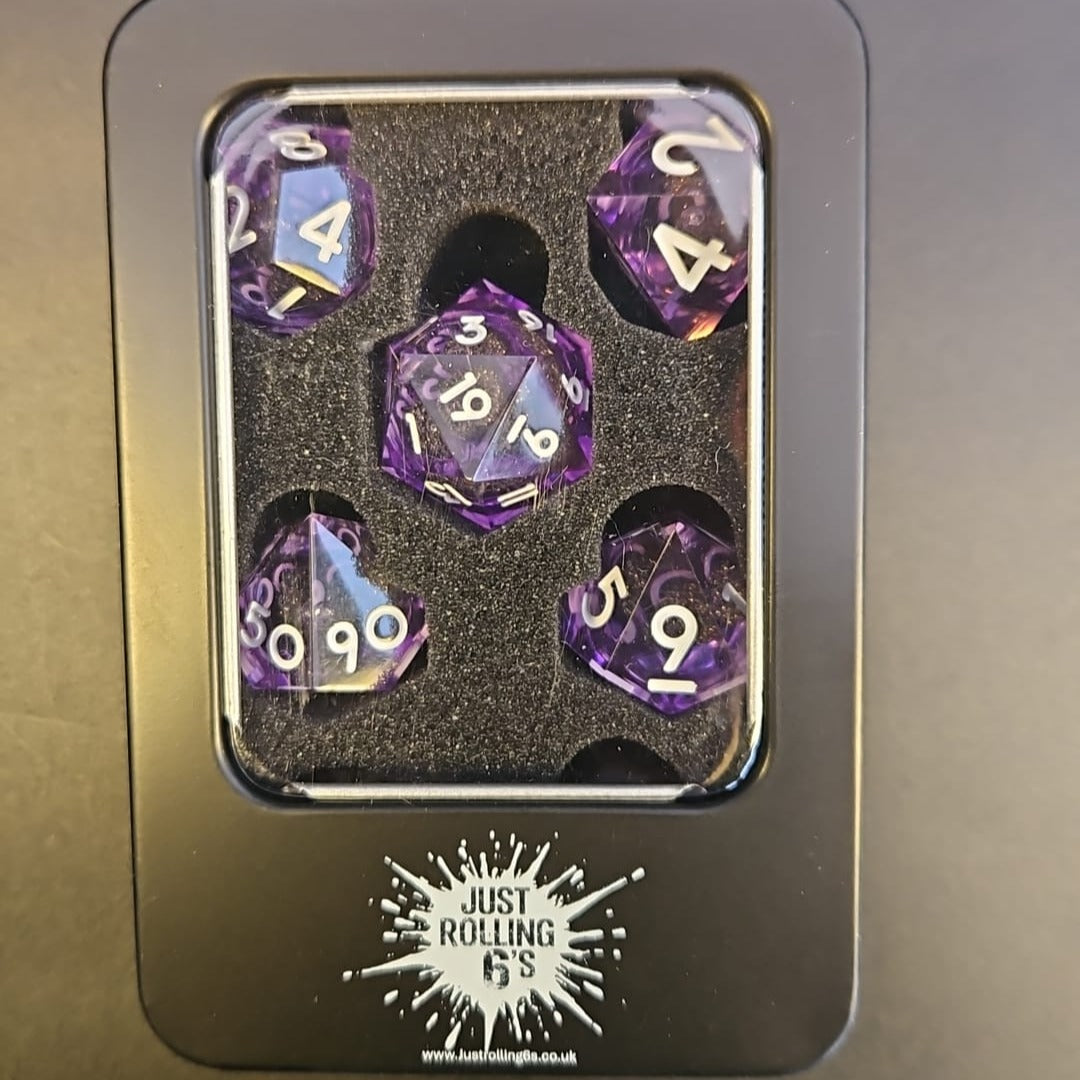 Purple Black and Gold Glitter 7 Piece Liquid Core Dice Set with white Numbering, in Metal Box